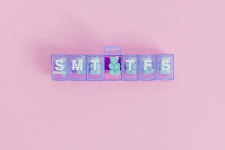 the word smothies spelled in block letters on a pink background