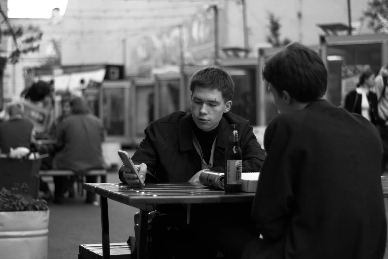 two people playing checkers in front of a crowd