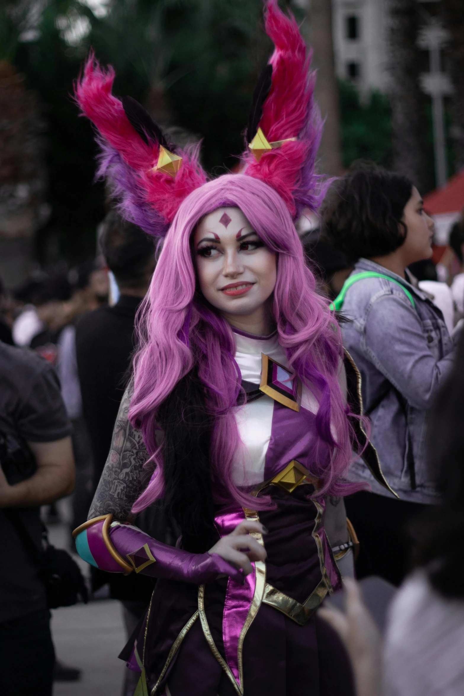 a woman in a costume with a dragon headpiece on