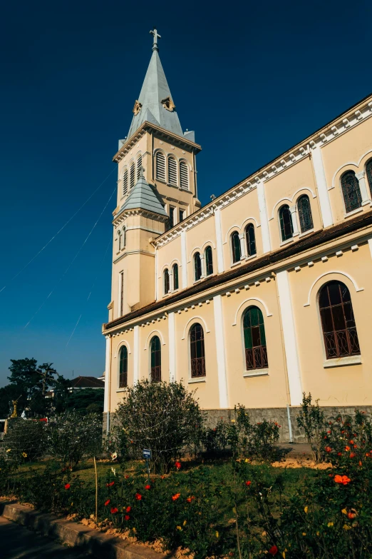 an old church with a steeple that is white and blue