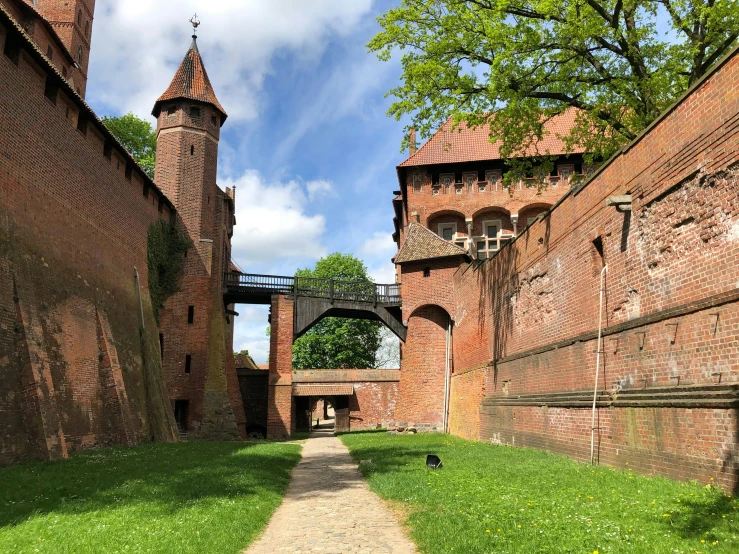 a path going through the brick walls of a city