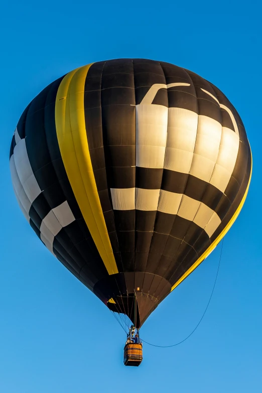 there are people riding in a  air balloon