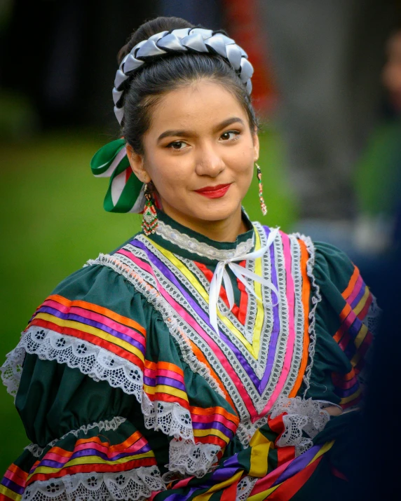 the woman is dressed in colorful outfits