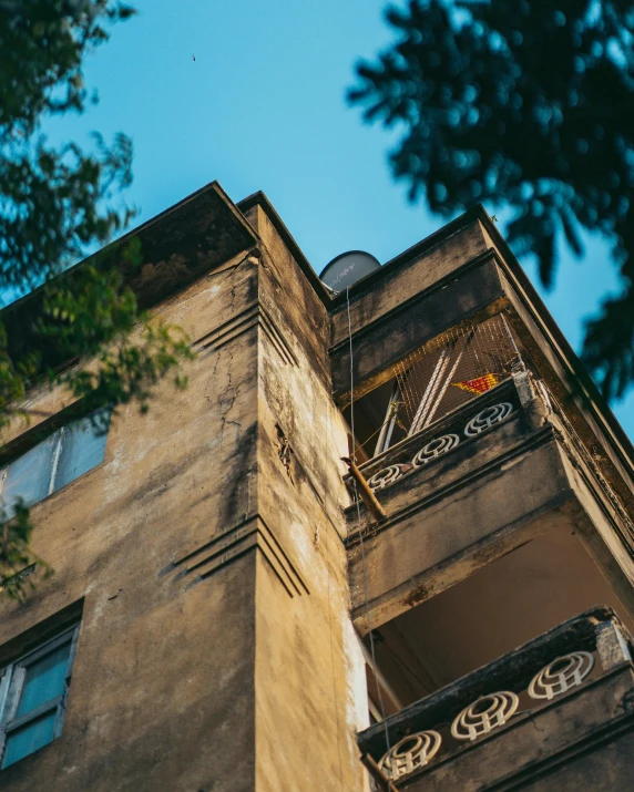 the building has a clock at the top and the second story is visible from underneath