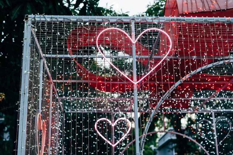 a caged metal heart sculpture with lights