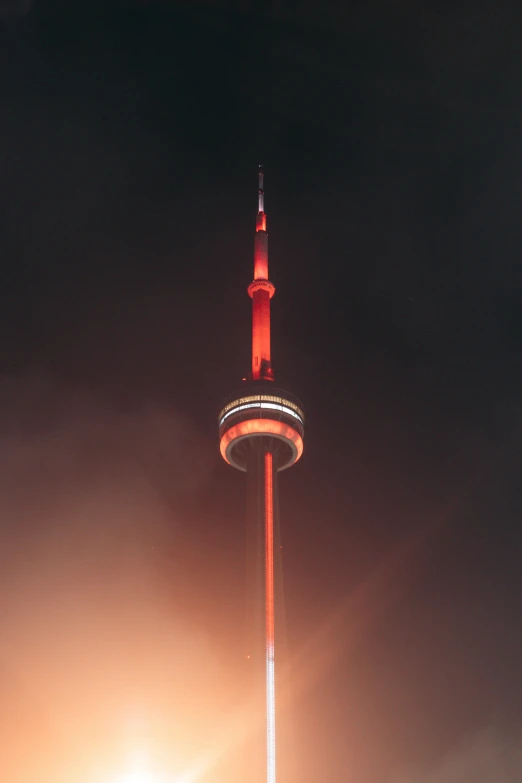 a light tower is lit up at night