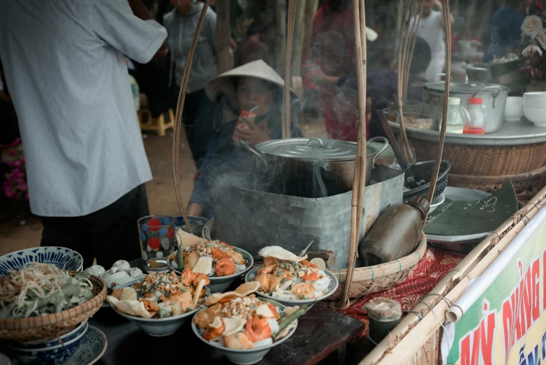 a large assortment of dishes sit on the counter