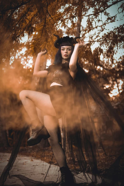 a woman with very long hair and a hat posing