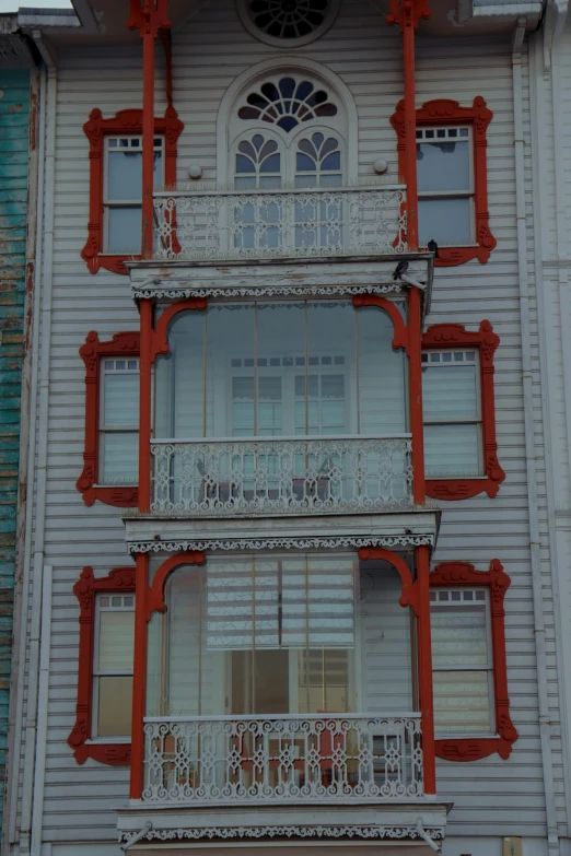 a building with a large window and many balconies