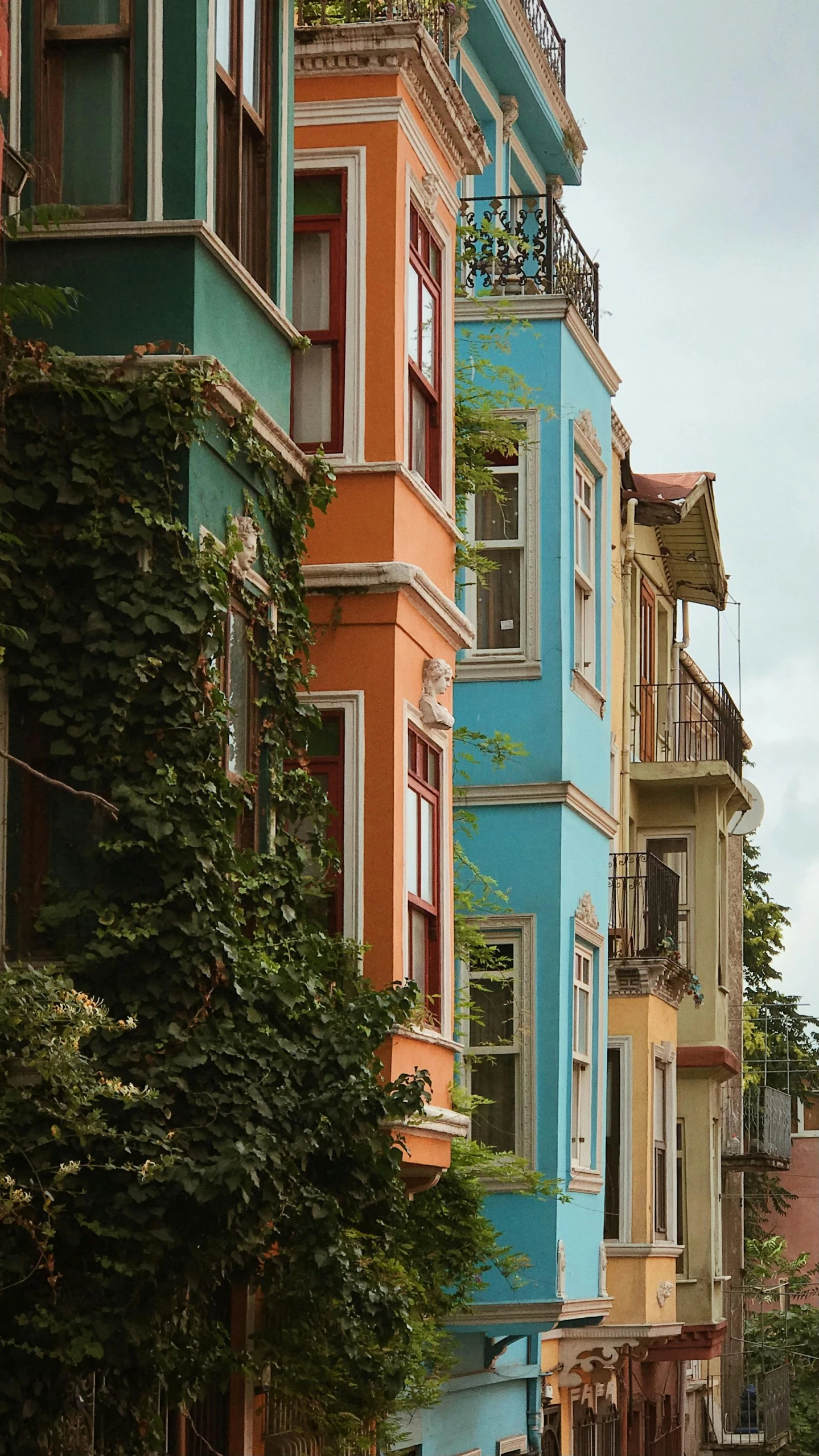 a street view of a row of apartment buildings