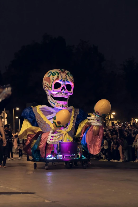 a skeleton like character on top of an elaborate car