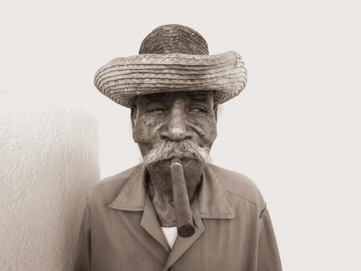 an old man with a straw hat and no nose