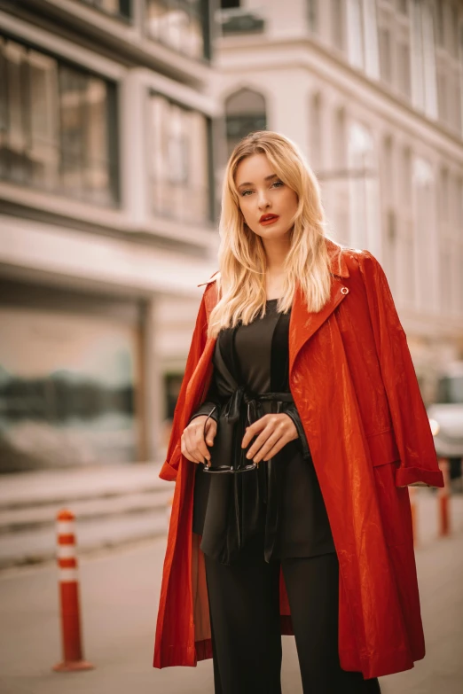 a blonde woman with red jacket and pants