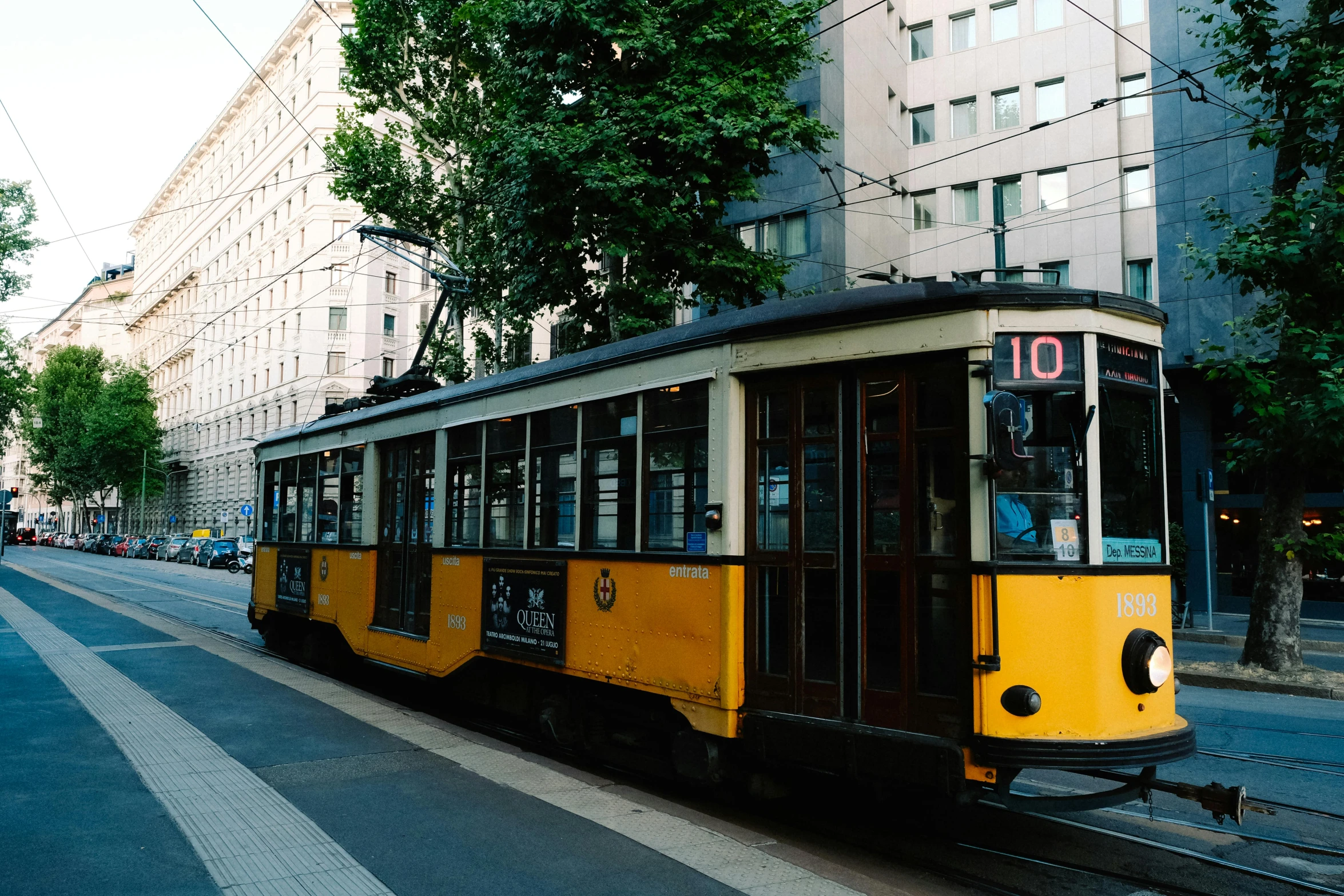 a tram car traveling down the tracks by itself