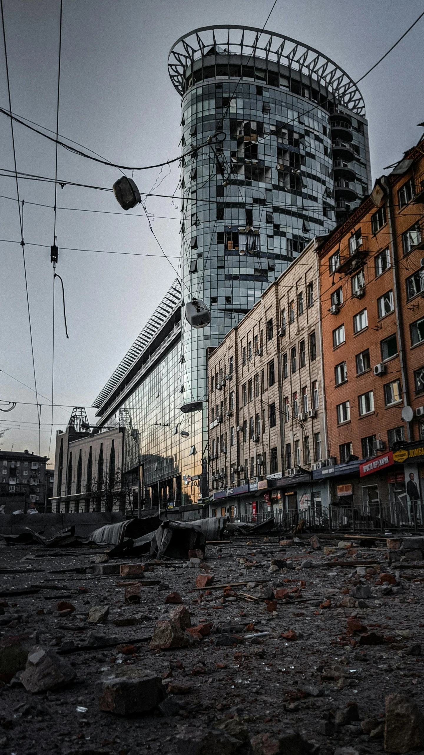 a very large building with some wires in front of it