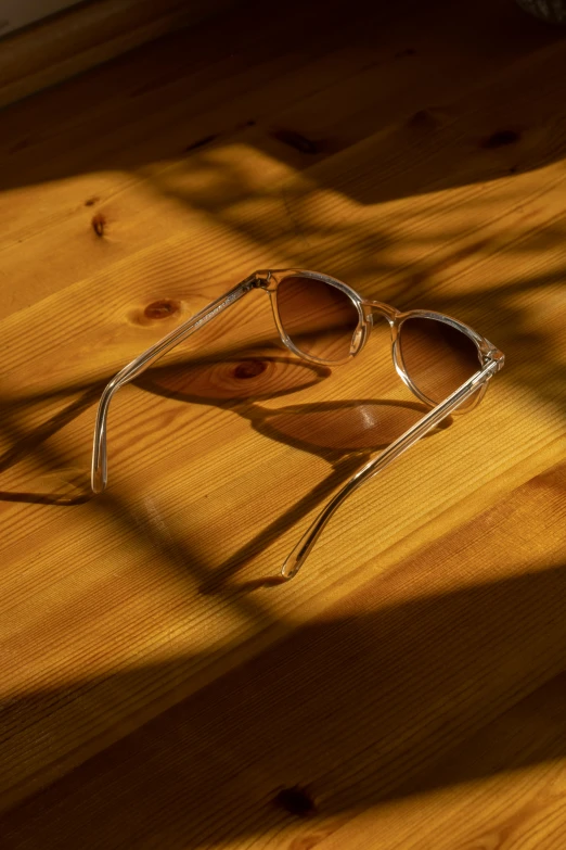 the sun is casting on a pair of sunglasses