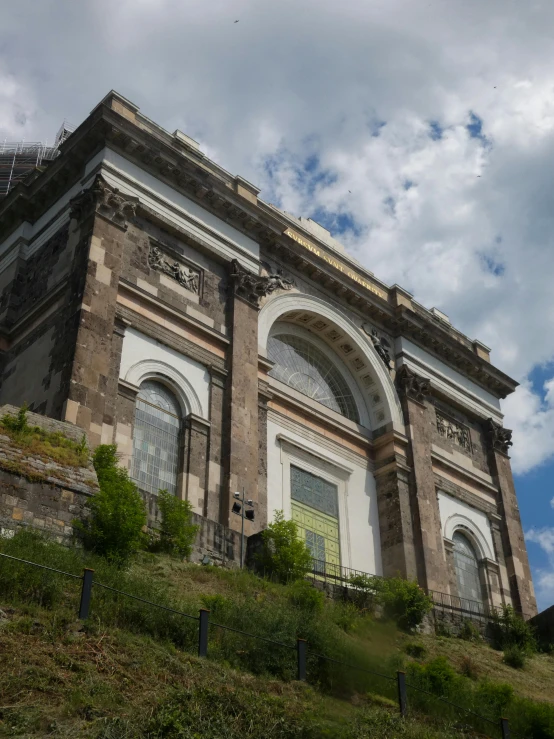 an architectural building is on a hill