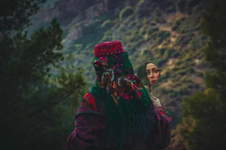 two women dressed in red and green clothing