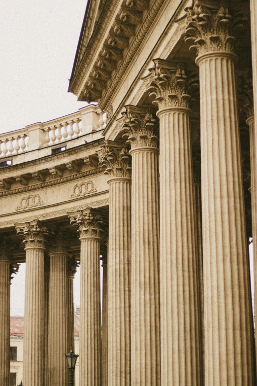 an old building with three pillars in the middle