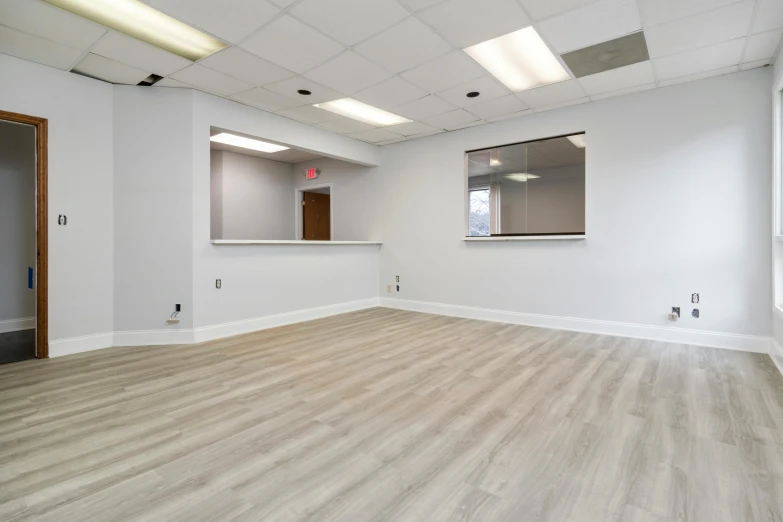 the empty office has large mirrors on the wall