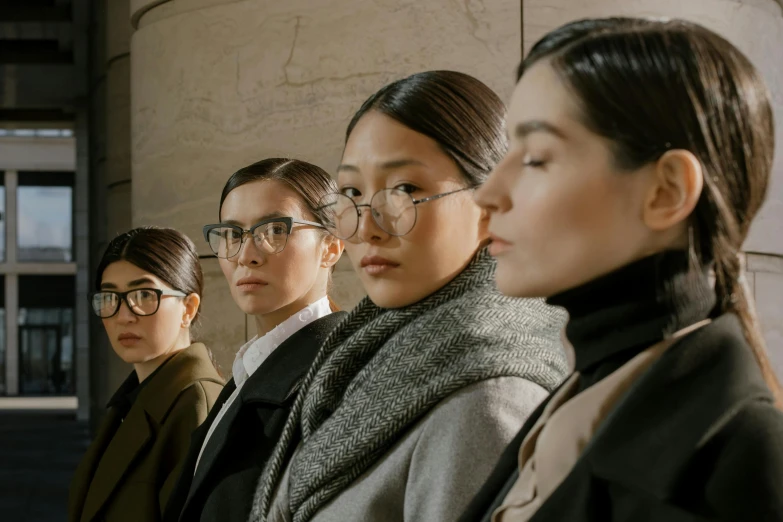 group of woman in glasses and standing side by side