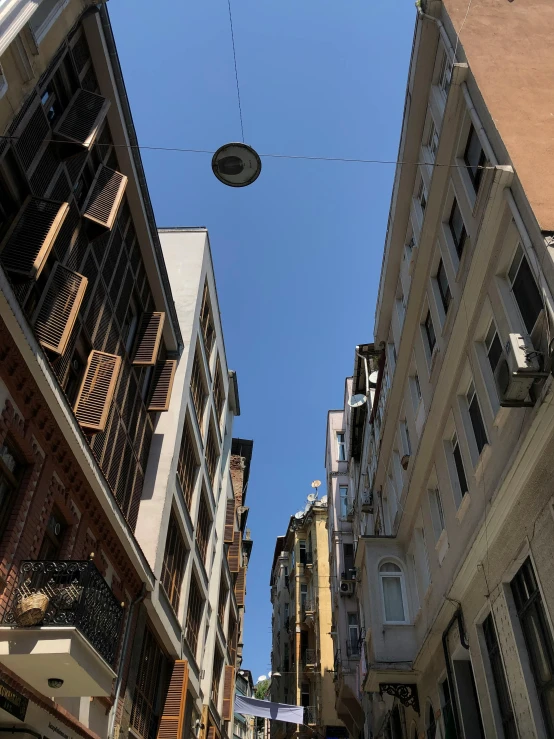 looking up at a narrow street in a european city