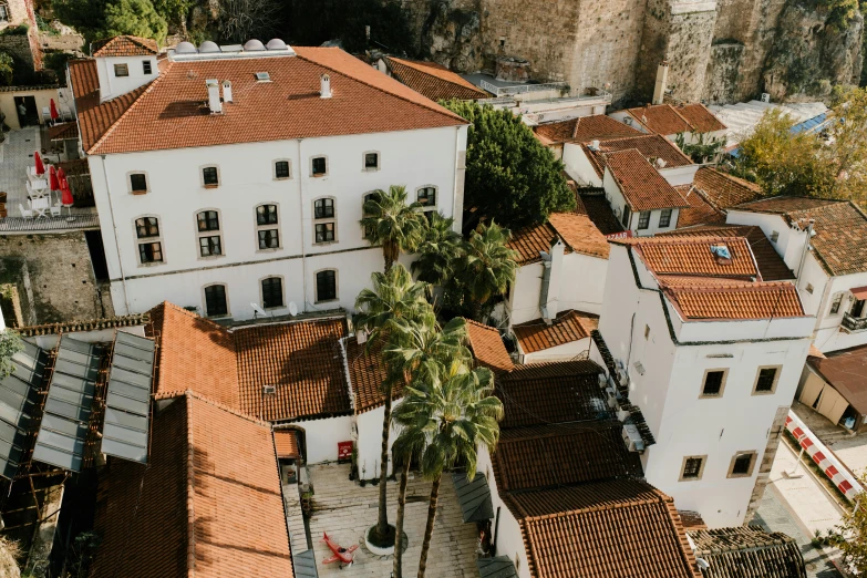 a town with a mountain side town and water falls