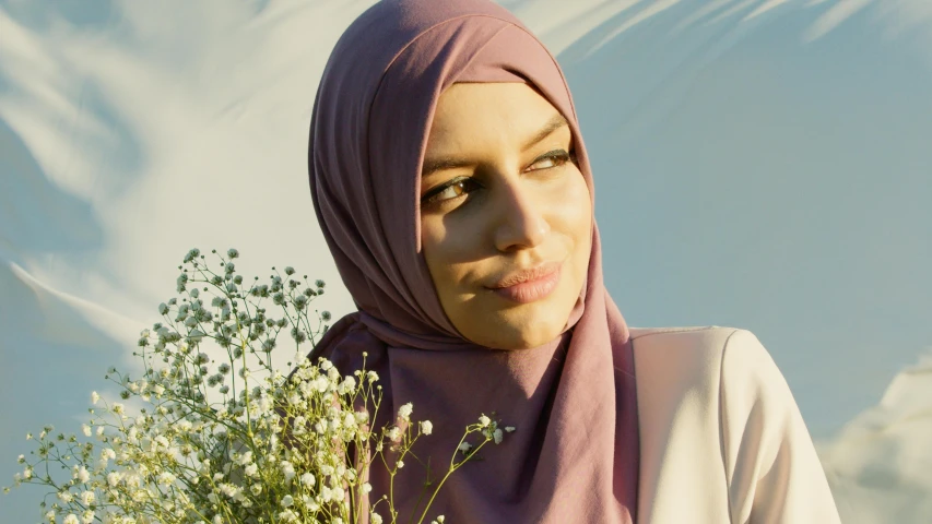 a close up of a person with a headscarf