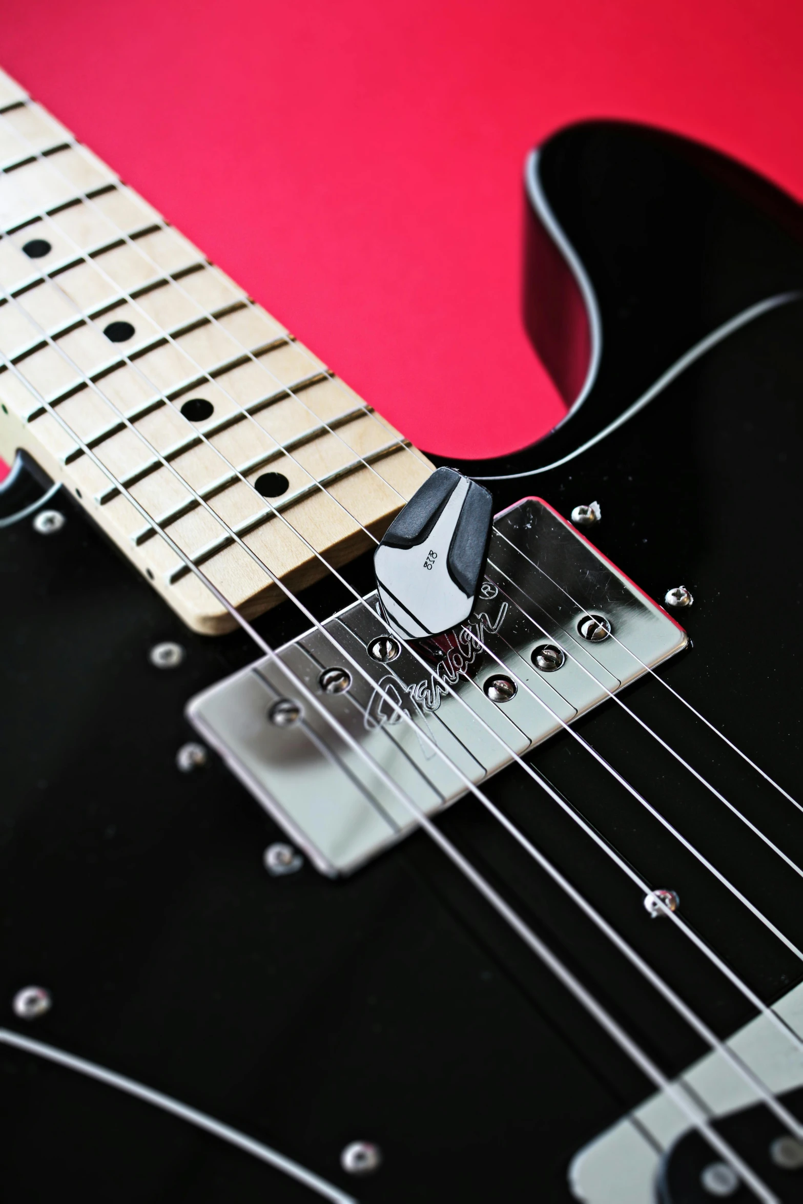 the neck and fret sections on an electric guitar