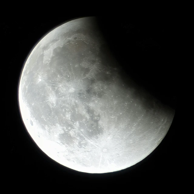 the moon as seen from space on a black background