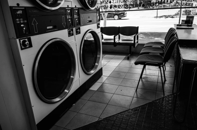 the inside of a store with washing machines on the front