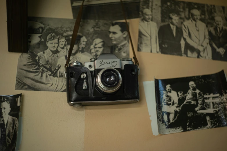 a po of people on a wall with a vintage camera