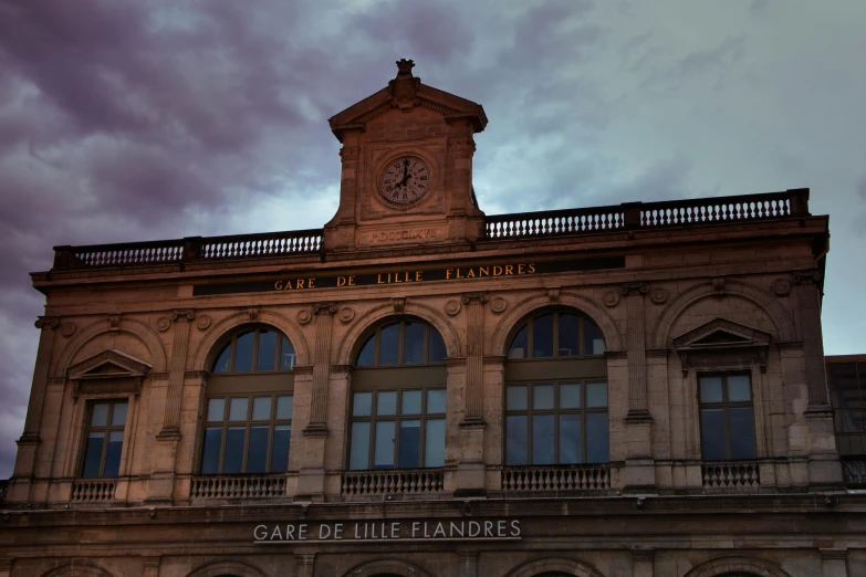 a cloudy, dreary day stands in front of a historic building