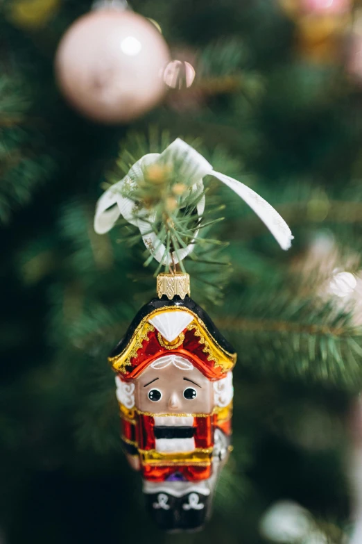 a ornament that is hanging from a christmas tree