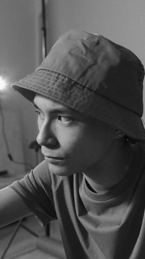 a young man sitting next to a tooth brush