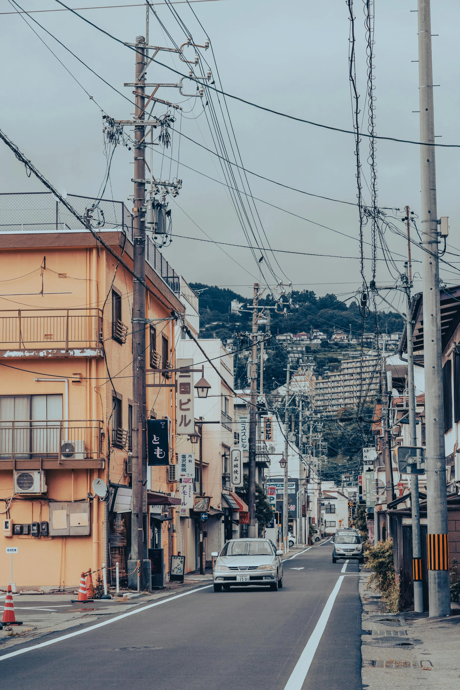 there are many electrical lines above this street