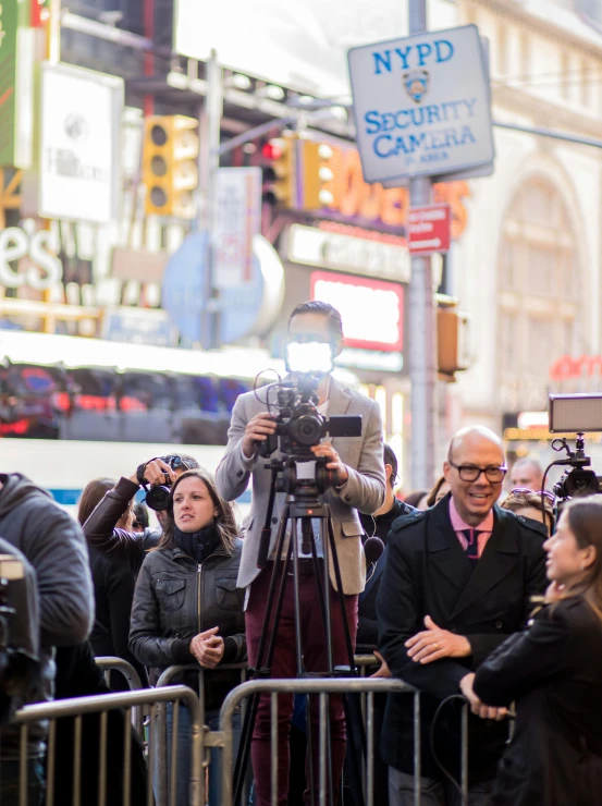 woman with microphone recording video of outdoor event