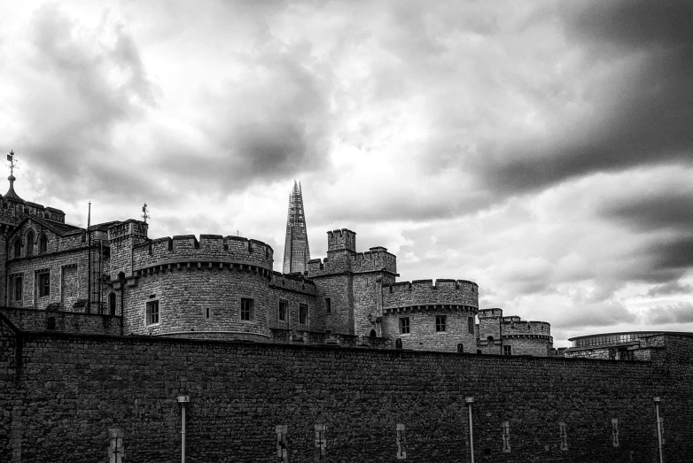 a view of a castle with dark clouds and dark sky