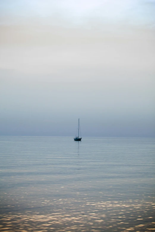 an image of a boat floating in the middle of the water