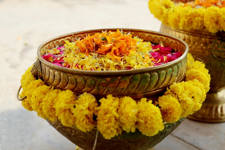 several baskets filled with flowers sitting on top of a wooden table