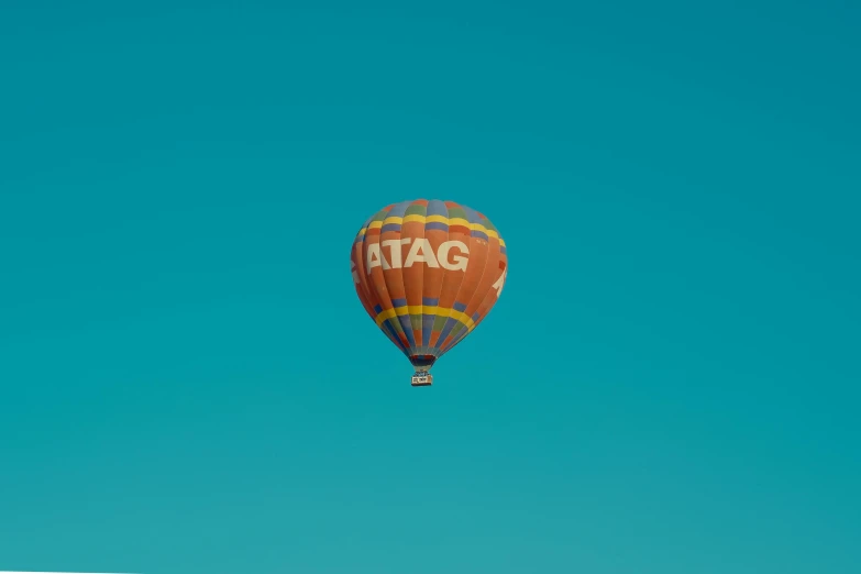 a  air balloon flies high up in the sky