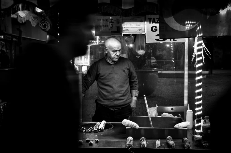 a man standing outside in front of a window