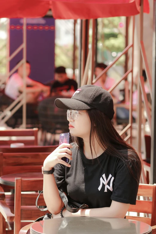 a person sitting down and eating food at a table