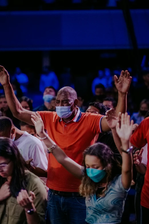 a group of people with masks on standing around