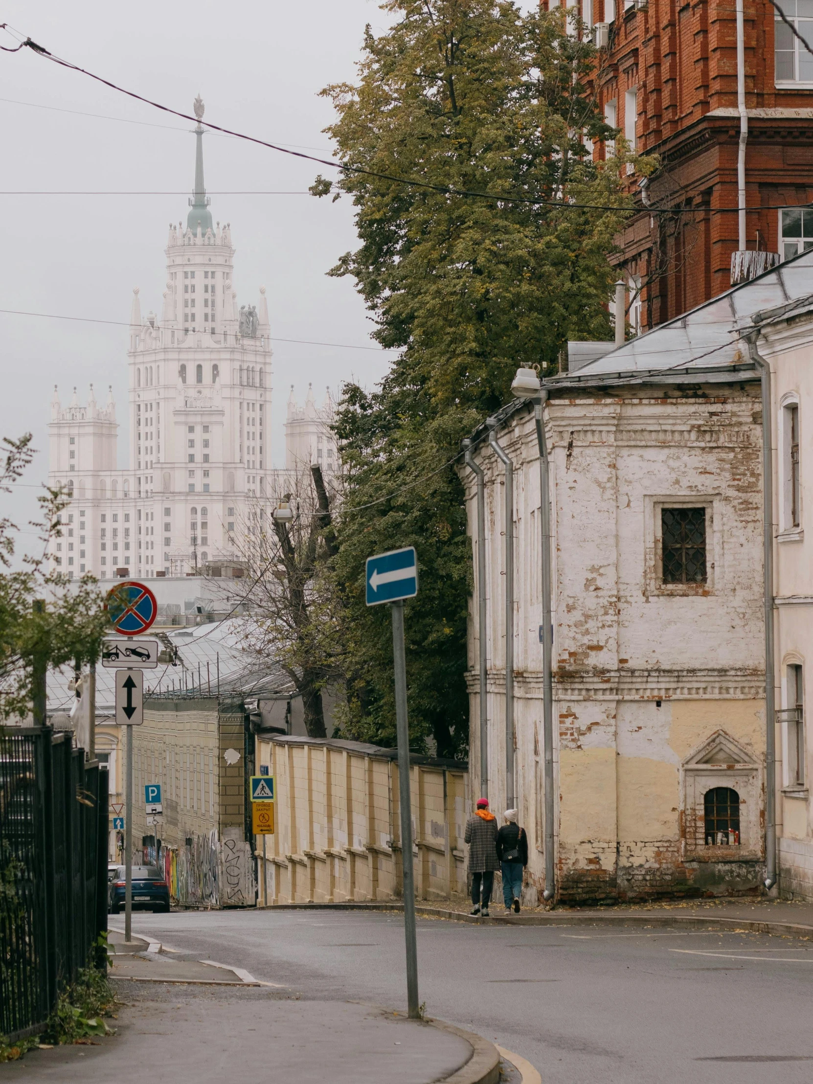 the old city is deserted with people walking in it