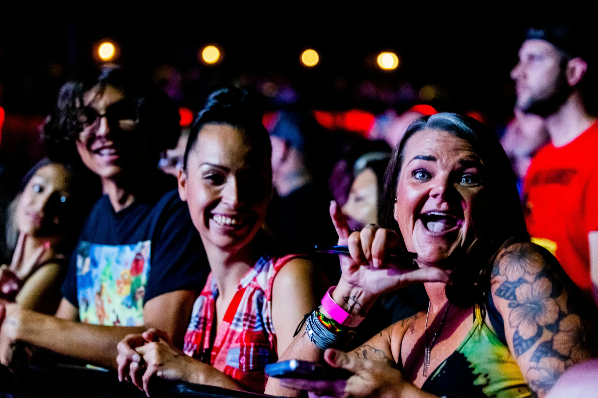 a group of people watching soing on a screen