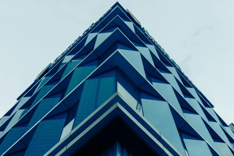 a triangular building with a red traffic sign