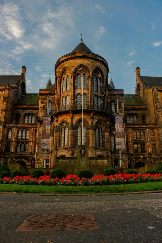 an old building with many windows sitting on the side