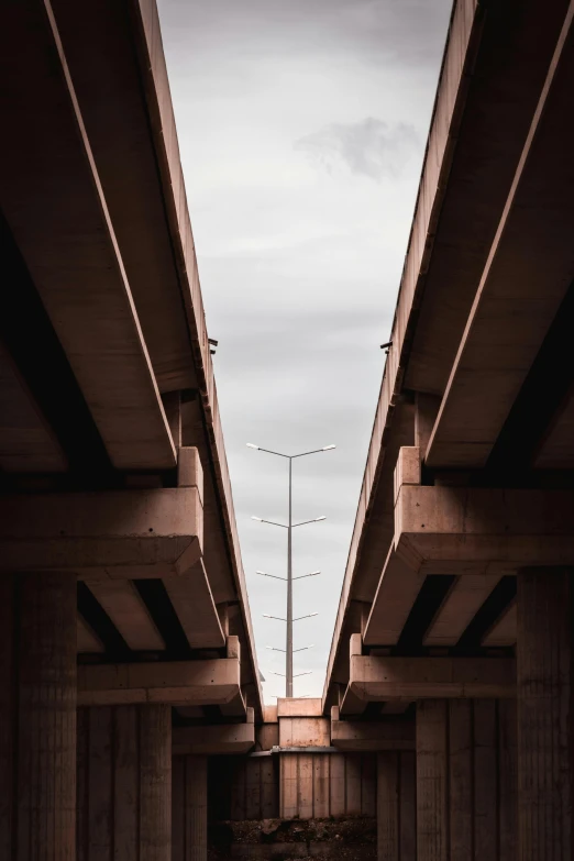 a po of the underside of a bridge, taken from below