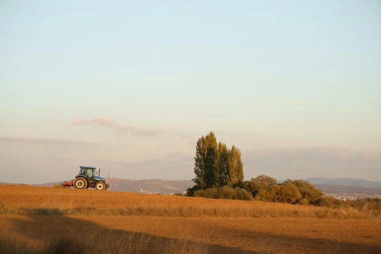 there is a tractor that is sitting in a field